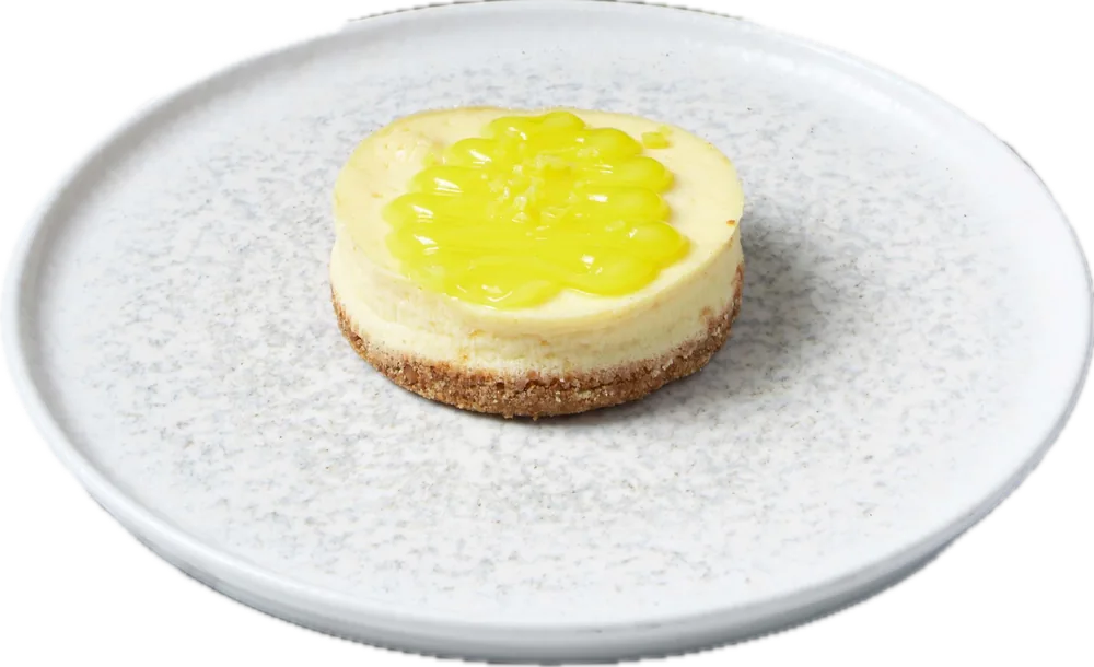 Lemon mono cheesecake on a plate, cut-out